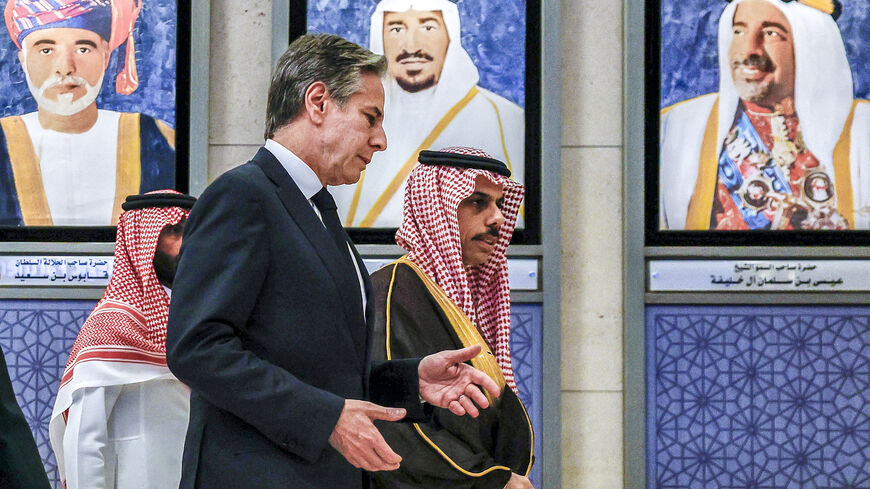 US Secretary of State Antony Blinken (C) speaks with Saudi Arabia's Foreign Minister Prince Faisal bin Farhan (R) as they walk past portraits of the founding leaders of the Gulf Cooperation Council during the Joint Ministerial Meeting of the GCC-US Strategic Partnership discussing the humanitarian situation in Gaza, at the GCC Secretariat in Riyadh on April 29, 2024. (Photo by EVELYN HOCKSTEIN / POOL / AFP) (Photo by EVELYN HOCKSTEIN/POOL/AFP via Getty Images)