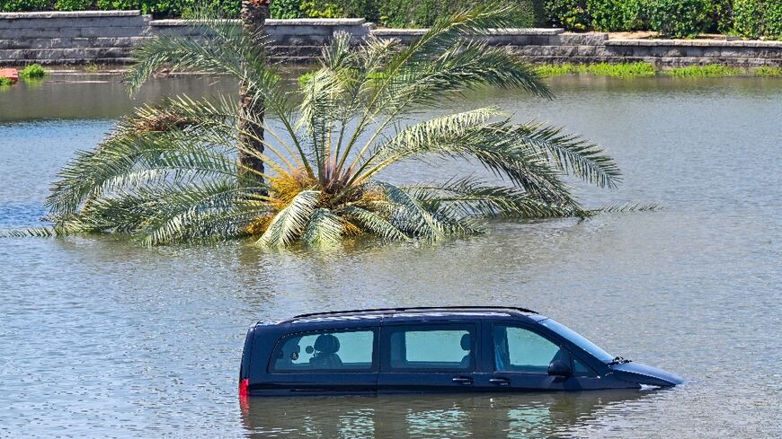 Cars are stranded on a flooded in Dubai following heavy rains on April 18, 2024