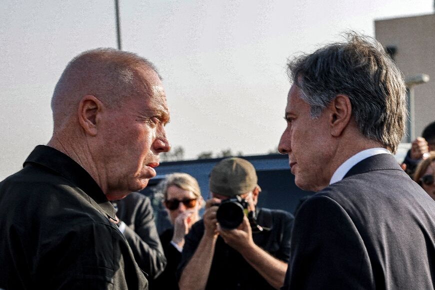 US Secretary of State Antony Blinken (R) stands with Israeli Defence Minister Yoav Gallant (L) at the Kerem Shalom border crossing with the Gaza Strip in southern Israel on May 1, 2024 