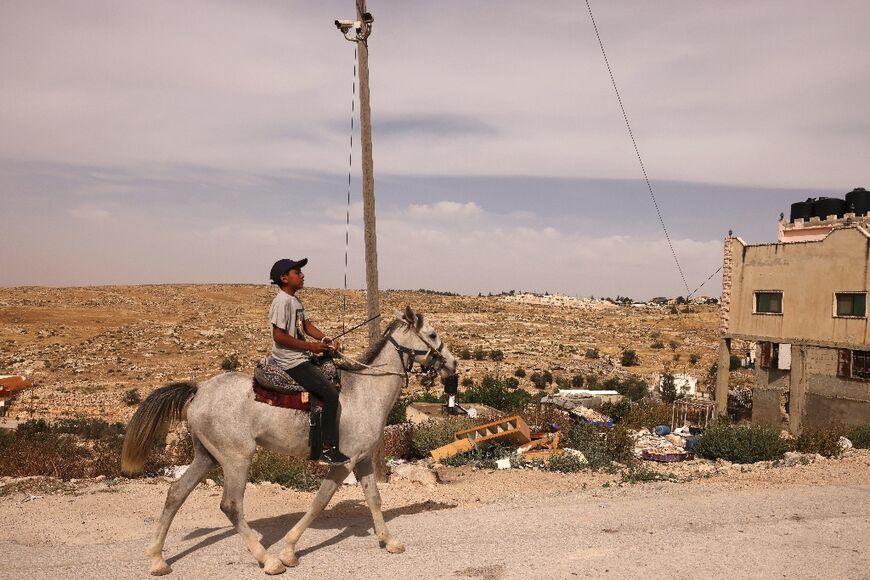 The Israeli settlement of Maaon can be seen in the distance from the Palestinian village of Al-Tuwani