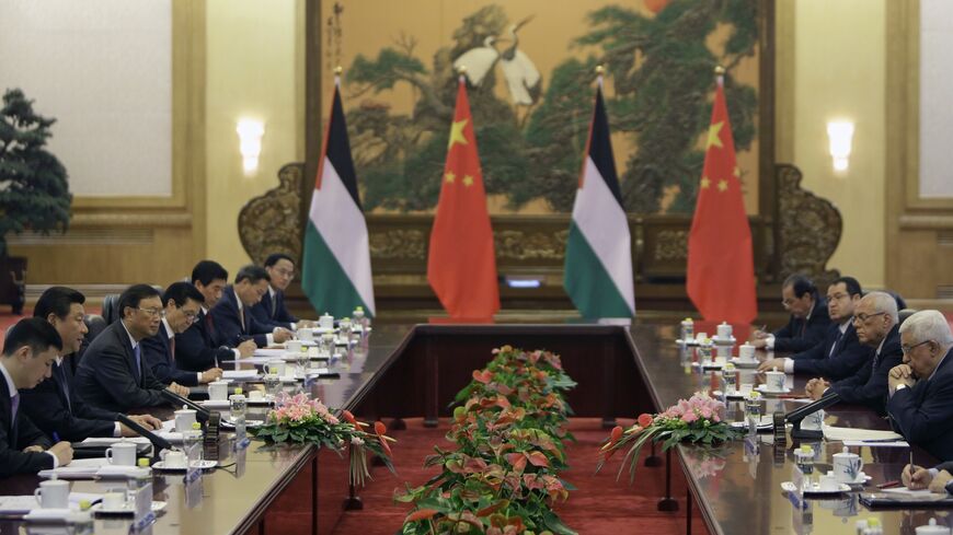 China's President Xi Jinping talks with his Palestinian counterpart Mahmoud Abbas (R) during a meeting at the Great Hall of the People in Beijing on May 6, 2013.