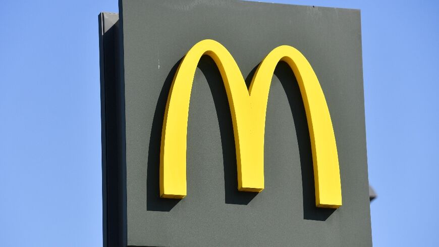 Although profits edged higher, McDonald's executives pointed to a continued drag in sales due to a boycott in the Middle East