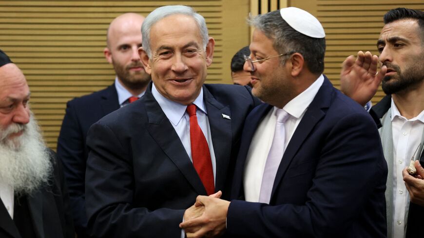 Israeli Prime Minister Benjamin Netanyahu (L) greets National Security Minister Itamar Ben-Gvir, during a media briefing ahead of a vote on the national budget, on May 23, 2023, at the parliament in Jerusalem. (Photo by GIL COHEN-MAGEN / AFP) (Photo by GIL COHEN-MAGEN/AFP via Getty Images)