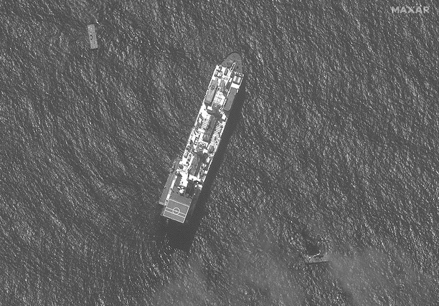 A US vessel and sections of a floating dock, off the war-torn Gaza Strip, seen in a satellite image courtesy of Maxar Technologies taken on April 29, 2024 