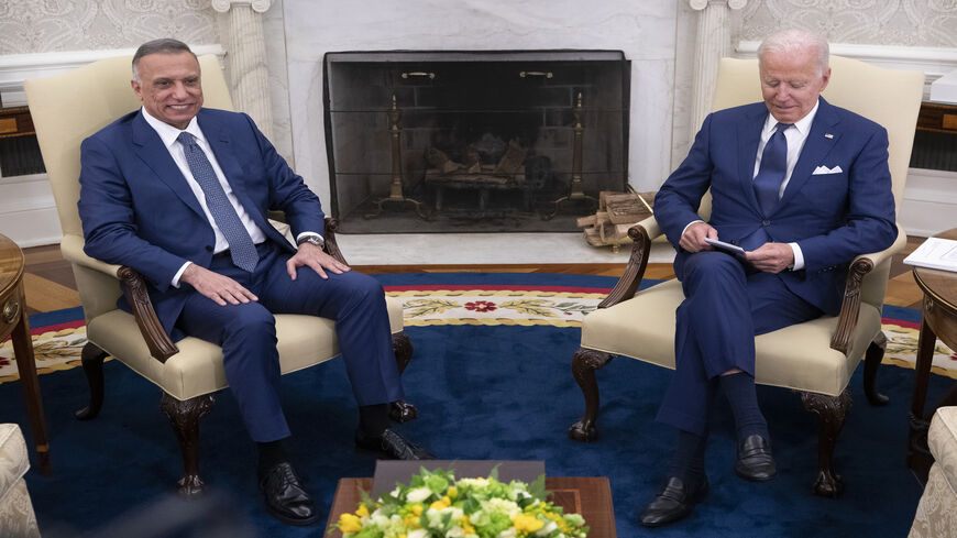 US President Joe Biden (R) hosts Iraqi Prime Minister Mustafa al-Kadhimi for a bilateral meeting in the Oval Office at the White House, Washington, July 26, 2021.