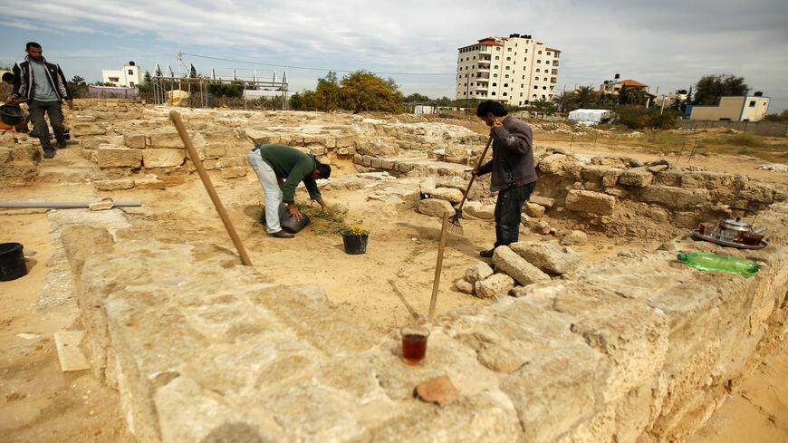 Palestinian workers clean a section of the archaeological site of the Saint Hilarion Monastery, one of the largest Christian monasteries in the Middle East, in Tell Umm al-Amr close to Deir al-Balah, in the central Gaza Strip, March 19, 2013.