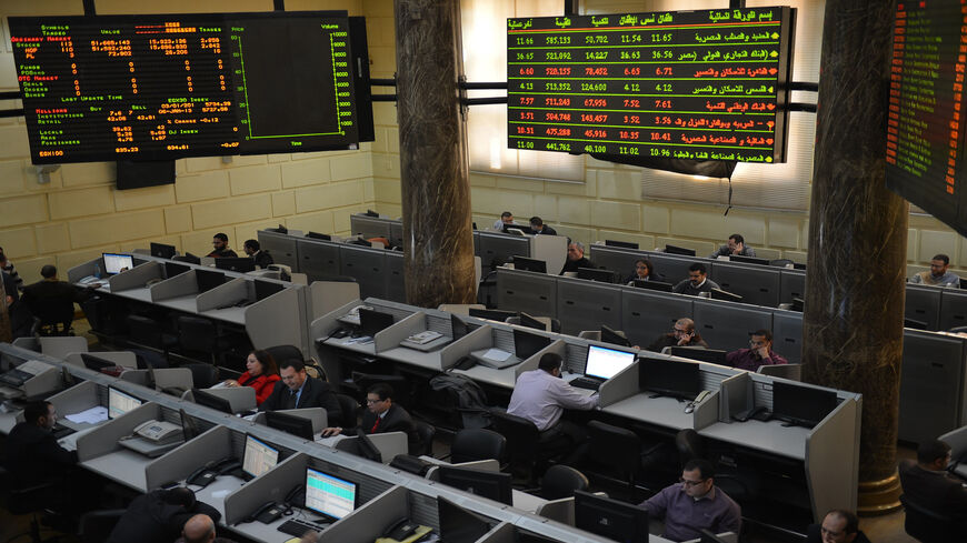 Stock market brokers work at the Egyptian Exchange, Cairo, Egypt, Jan. 6, 2013.