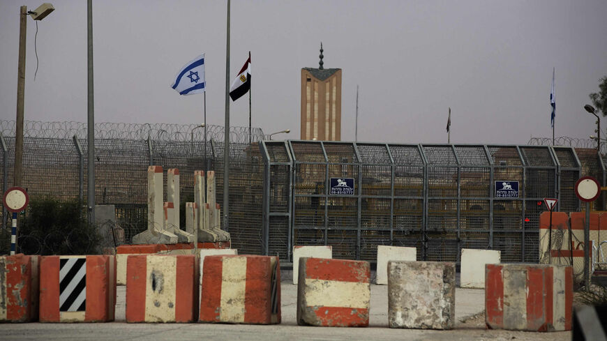 Israeli and Egyptian flags are seen at the Nitzana border crossing along the southern Israeli border with Egypt near the Israeli village of Nitzanei Sinai, Aug. 20, 2013.