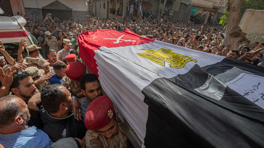 Mourners and soldiers carry the casket of Egyptian 1st Lt. Soleman Ali Soleman, one of 11 soldiers killed in an attack claimed by Wilayat Sinai, during his funeral at a mosque in the village of Jazirat al-Ahrar in Qalyoubiya province, Egypt, May 9, 2022.