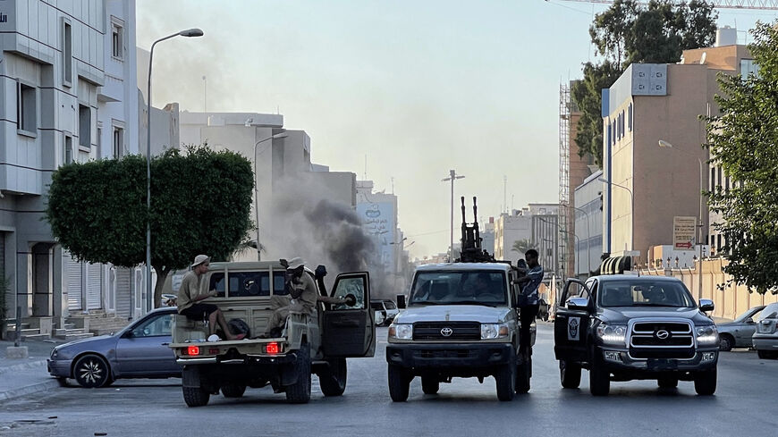 Fighters loyal to the Government of National Unity are pictured in a street in Tripoli, following clashes between rival Libyan groups, Libya, Aug. 27, 2022.