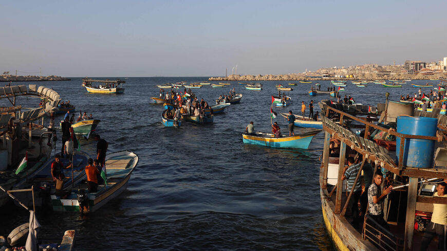 Palestinians participate in a rally at the Gaza City seaport to demand their right to receive gas from maritime fields in the eastern Mediterranean and the lifting of the Israeli blockade, Gaza Strip, Sept. 13, 2022.