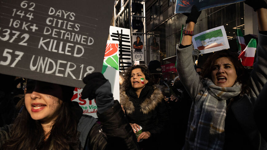 Protesters call on the United Nations to take action against the treatment of women in Iran, following the death of Mahsa Amini while in the custody of the morality police, during a demonstration in Times Square, New York, Nov. 19, 2022.