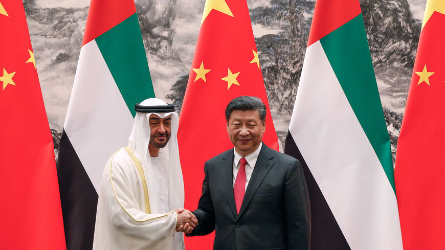 Abu Dhabi's crown prince, Sheikh Mohammed bin Zayed Al Nahyan, left, shakes hands with Chinese President Xi Jinping after witnessed a signing ceremony at the Great Hall of the People in Beijing, Monday, July 22, 2019. (Photo by Andy Wong-Pool/Getty Images)