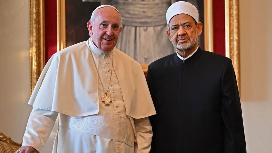 Pope Francis (L) poses for a picture with the Grand Imam of al-Azhar mosque Sheikh Ahmed Al-Tayeb during their meeting at the Papal residence near the Sakhir Royal Palace, in the eponymous Bahraini city on Nov. 4, 2022.
