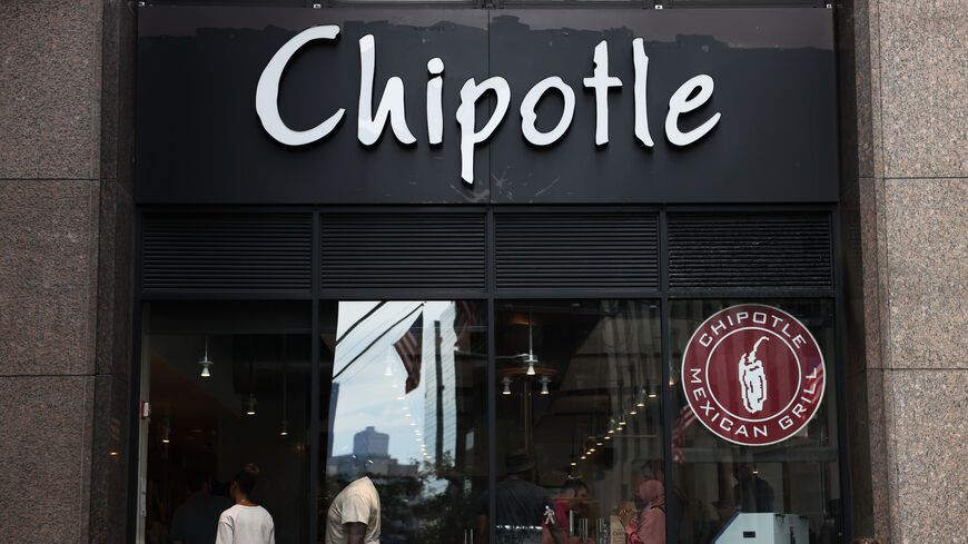 NEW YORK, NEW YORK - AUGUST 10: A Chipotle store signage is seen on August 10, 2022 in New York City. NYC Mayor Eric Adams announced on Tuesday that Chipotle Mexican Grill announced that they will be paying $20 million dollars to current and former workers in their NYC restaurants for violating city labor laws. The settlement will cover about 13,000 employees who worked at the chain's NYC stores between 2017 and this year. (Photo by Michael M. Santiago/Getty Images)