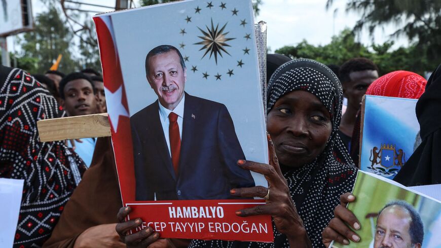 Somalis celebrate the victory of Turkish President Recep Tayyip Erdogan after he won the presidential run-off election during the celebrations organised by the government in Mogadishu, on May 29, 2023. 