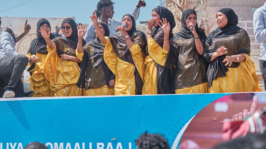 A group of singers perform Somali nationalistic songs during a demonstration in support of Somalia's government following the port deal signed between Ethiopia and the breakaway region of Somaliland at Eng Yariisow Stadium in Mogadishu on January 3, 2024. Somalia vowed to defend its territory after a controversial Red Sea access deal between Ethiopia and the breakaway state of Somaliland that it branded as "aggression". (Photo by ABDISHUKRI HAYBE / AFP) (Photo by ABDISHUKRI HAYBE/AFP via Getty Images)