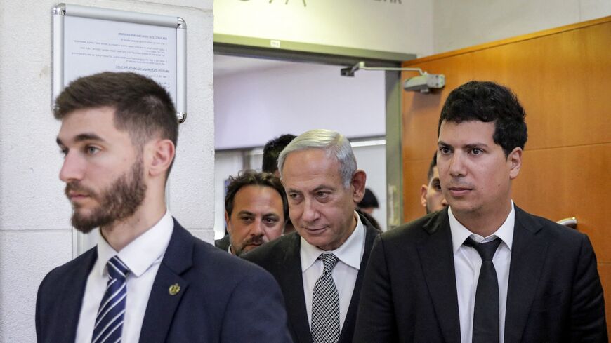 Israeli Prime Minister Benjamin Netanyahu (C) exits after testifying in a hearing at the Magistrate's Court, Rishon Lezion, Jan. 23, 2023.