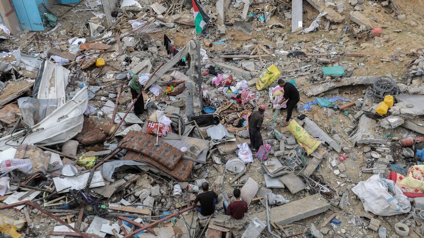 Palestinian citizens inspect the effects of destruction caused by air strikes on their homes on Nov. 25, 2023 in Khan Yunis, Gaza.