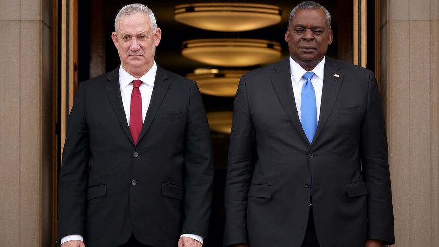 US Secretary of Defense Lloyd Austin (R) and Israeli Minister of Defense Benny Gantz (L) stand at attention during the playing of the Israeli national anthem at an arrival ceremony at the Pentagon June 3, 2021 in Arlington, Virginia. 