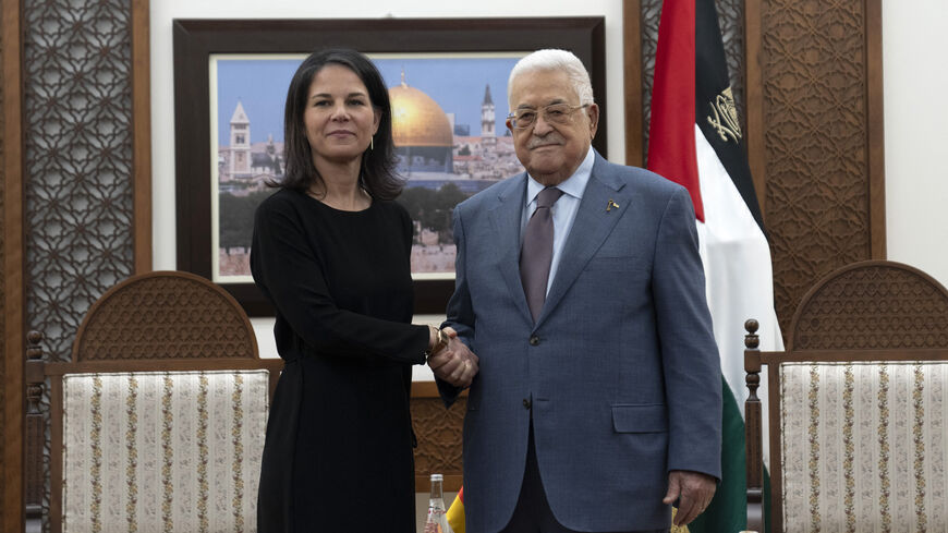 Palestinian President Mahmud Abbas (R) receives German Foreign Minister Annalena Baerbock at his office in the West Bank city of Ramallah on March 25, 2024. (Photo by Nasser Nasser / POOL / AFP) (Photo by NASSER NASSER/POOL/AFP via Getty Images)