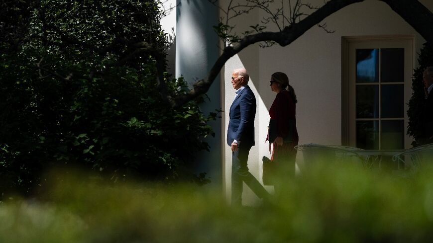 US President Joe Biden and Deputy Chief of Staff Annie Tomasini depart the Oval Office and walk to Marine One on the South Lawn of the White House in Washington, DC, on April 16, 2024.  Biden is travelling to Scranton, Pennsylvania.