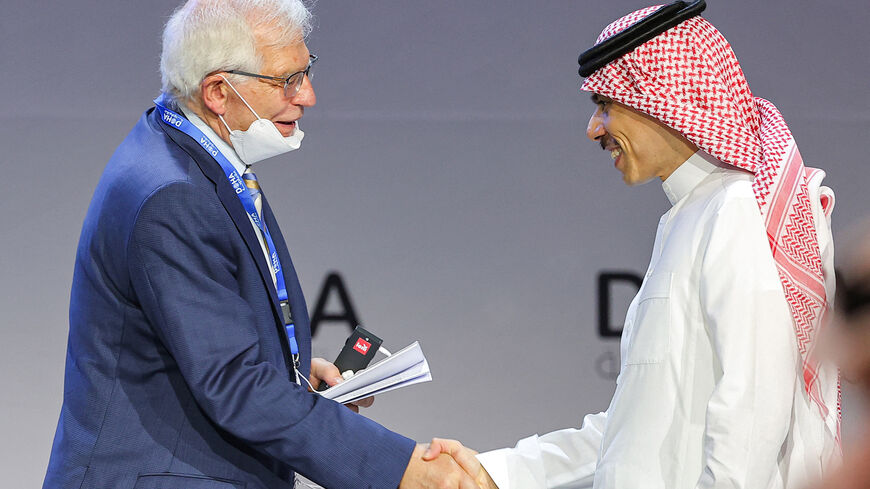 (L to R) EU High Representative for Foreign Affairs and Security Policy Josep Borrell shakes hands with Saudi Arabia's Foreign Minister Prince Faisal bin Farhan al-Saud during a plenary session titled "Transforming for a New Era", during the Doha Forum in Qatar's capital on March 26, 2022. (Photo by KARIM JAAFAR / AFP) (Photo by KARIM JAAFAR/AFP via Getty Images)