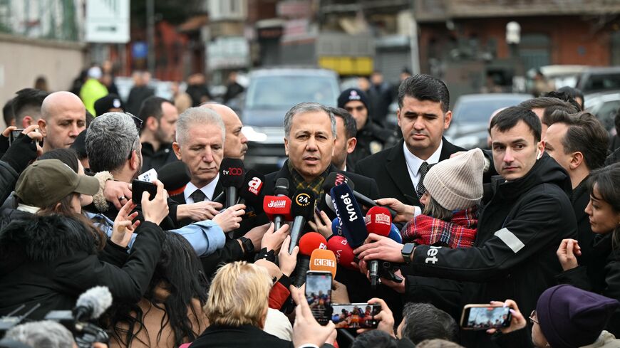 Turkish Interior Minister Ali Yerlikaya (C) addresses the press next to Santa Maria Church after an attack, in Istanbul, on Jan. 28, 2024. 