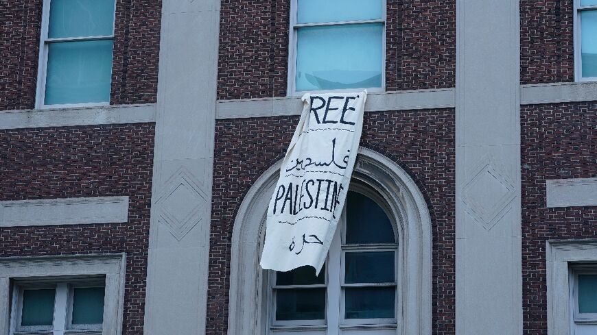 A 'Free Palestine' banner hangs on a Columbia University building on April 30, 2024 