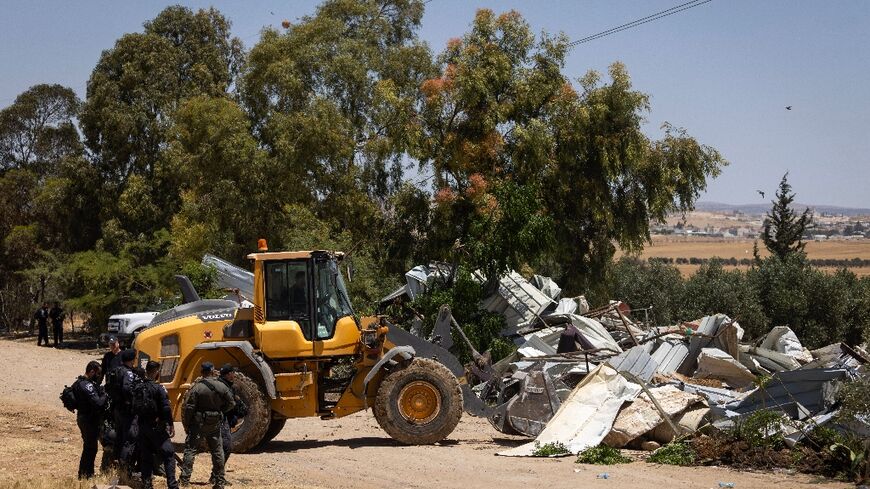 Israeli security forces demolish Bedouin homes in the Negev desert which authorities have described as 'illegal' constructions
