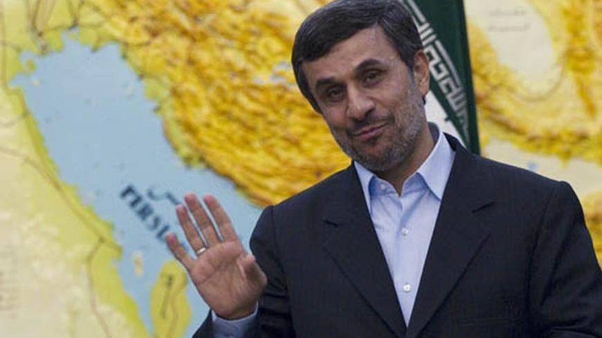 EDITORS' NOTE: Reuters and other foreign media are subject to Iranian restrictions on leaving the office to report, film or take pictures in Tehran.
Iranian President Mahmoud Ahmadinejad jokes with journalists as he waits to meet with India's Minister for New and Renewable Energy Farooq Abdullah (not pictured) in Tehran March 4, 2012.  REUTERS/Caren Firouz   (IRAN - Tags: POLITICS ENERGY)