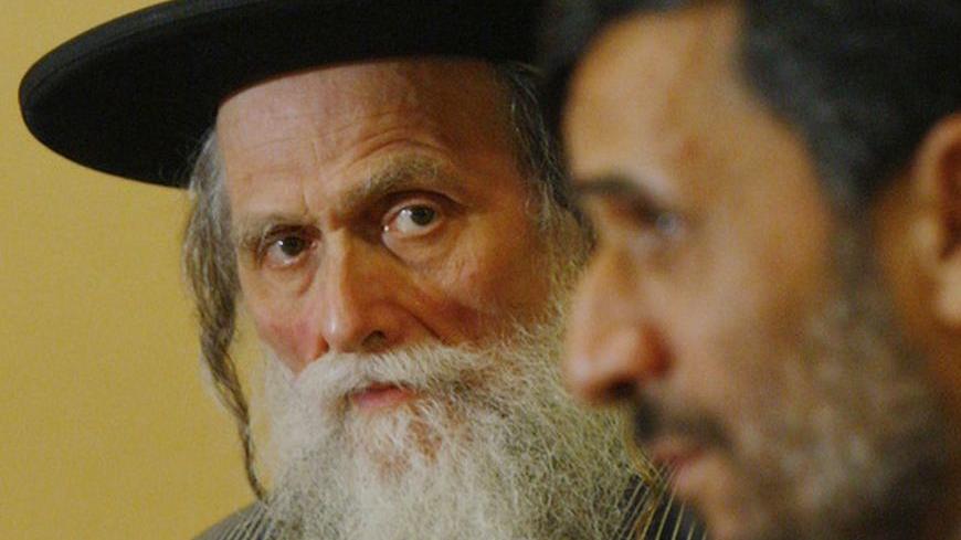 Iran's President Mahmoud Ahmadinejad (R) speaks as Rabbi Moshe Ber Beck of Neturei Karta, a fringe Ultra-Orthodox movement within the anti-Zionist bloc, listens during a meeting in New York, September 24, 2008.     REUTERS/Brendan McDermid (UNITED STATES)