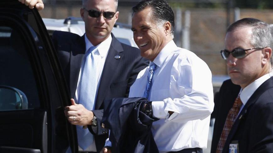 U.S. Republican presidential nominee and former Massachusetts Governor Mitt Romney is surrounded by U.S. Secret Service agents as steps off his campaign plane in Dallas, Texas, September 19, 2012.       REUTERS/Jim Young (UNITED STATES - Tags: POLITICS ELECTIONS)