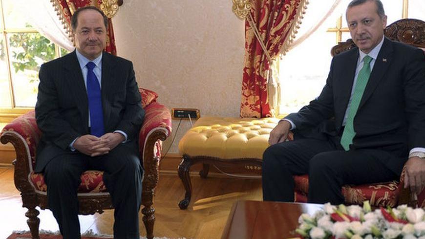 Turkey's Prime Minister Tayyip Erdogan (R) meets Iraqi Kurdish Regional President Masoud Barzani at his office in Istanbul November 5, 2011. REUTERS/Mustafa Ozer/Pool  (TURKEY - Tags: POLITICS)