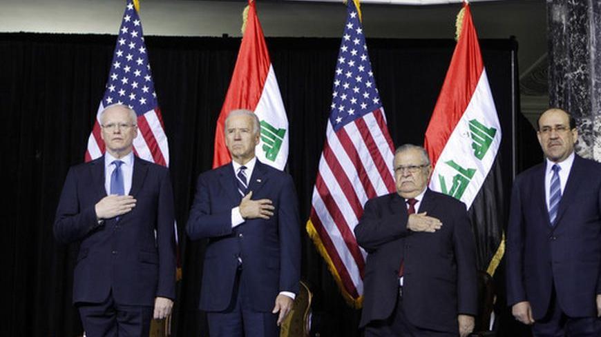 U.S. Ambassador to Iraq James Jeffrey (L), U.S. Vice President Joe Biden (2nd L), Iraq's Prime Minister Nuri al-Maliki (R) and Iraq's President Jalal Talabani stand for the national anthem during one of several planned ceremonies to mark the end of American military presence in Iraq, in Baghdad December 1, 2011. The last 13,000 U.S. troops will pull out of Iraq by the end of the year. Violence in the country has dropped sharply since the heights of sectarian slaughter in 2006-2007, but at least 10 people we