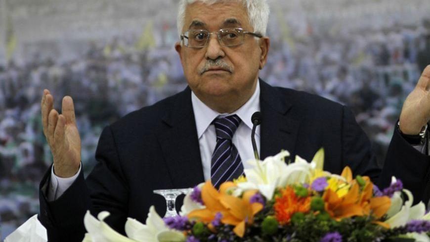 Palestinian President Mahmoud Abbas gestures during a news conference in the West Bank city of Ramallah November 16, 2012.   Palestinian militants nearly hit Jerusalem with a rocket for the first time in decades on Friday and fired at Tel Aviv for a second day, in a stinging challenge to Israel's Gaza offensive after an Egyptian bid to broker a truce. REUTERS/Mohamad Torokman (WEST BANK - Tags: POLITICS CIVIL UNREST)