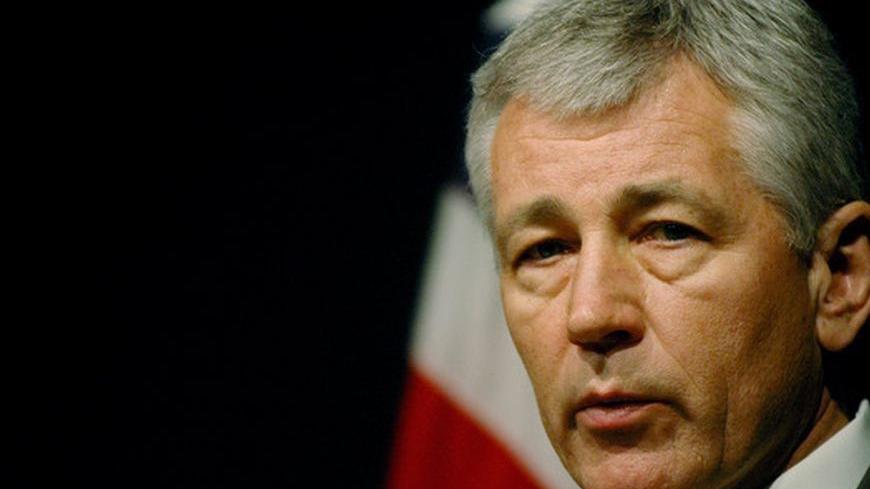 U.S. Senator Chuck Hagel speaks during a news conference at the U.S. embassy in Islamabad April 13, 2006. "I do not expect any kind of military solution on the Iran issue," Hagel told a news conference in Islamabad, stressing that he was speaking for himself rather than the Senate or the Bush administration. Hagel said President George W. Bush and senior members of his cabinet had said the military option was not a responsible approach to resolving the issues.  REUTERS/Mian Khursheed