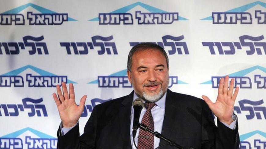 Israeli Foreign Minister Avigdor Lieberman gestures as he speaks at a conference for young members of his Yisrael Beiteinu party in Tel Aviv December 13, 2012. Lieberman said on Thursday he need not resign after the Justice Ministry decided to indict him for fraud and breach of trust, less severe charges than were originally considered. REUTERS/Amir Cohen (ISRAEL - Tags: POLITICS)
