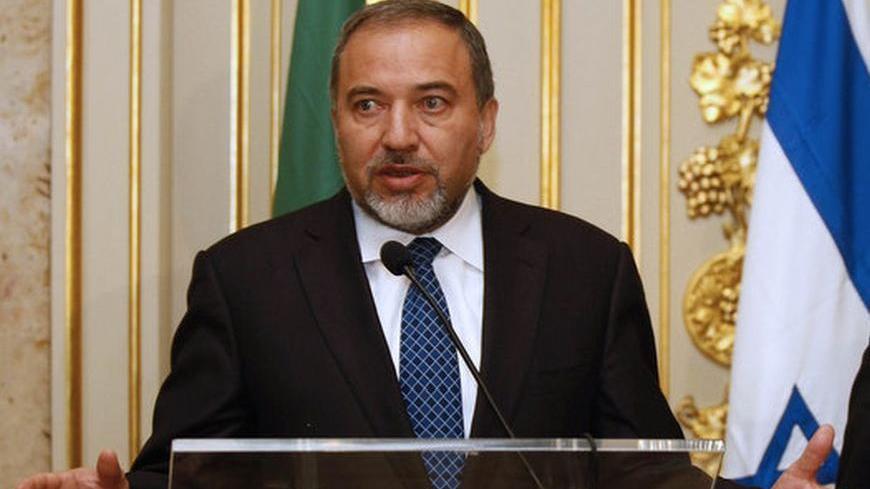 Israel's Foreign Affairs Minister Avigdor Liberman (L) talks to journalists, next to Portuguese counterpart Luis Amado after a meeting in Lisbon January 25, 2011.  REUTERS/Jose Manuel Ribeiro  (PORTUGAL - Tags: POLITICS)