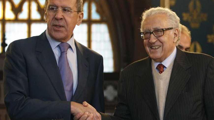 Russia's Foreign Minister Sergei Lavrov (L) shakes hands with U.N.-Arab League peace mediator Lakhdar Brahimi of Algeria, in Moscow December 29, 2012.  REUTERS/Sergei Karpukhin  (RUSSIA - Tags: POLITICS)