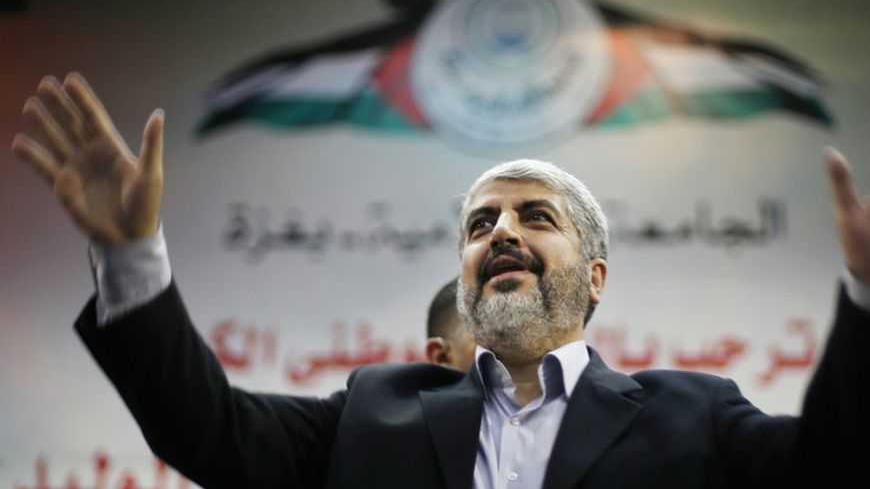 Hamas chief Khaled Meshaal waves to Palestinian student during his visit to the Islamic University in Gaza City December 9, 2012. Hamas's vow to vanquish Israel after claiming "victory" in last month's Gaza conflict vindicates Israel's reluctance to relinquish more land to the Palestinians, Prime Minister Benjamin Netanyahu said on Sunday. Khaled Meshaal, the leader of the Islamist Hamas movement, made a defiant speech before thousands of supporters in the Gaza Strip on Saturday, promising to take "inch-by-