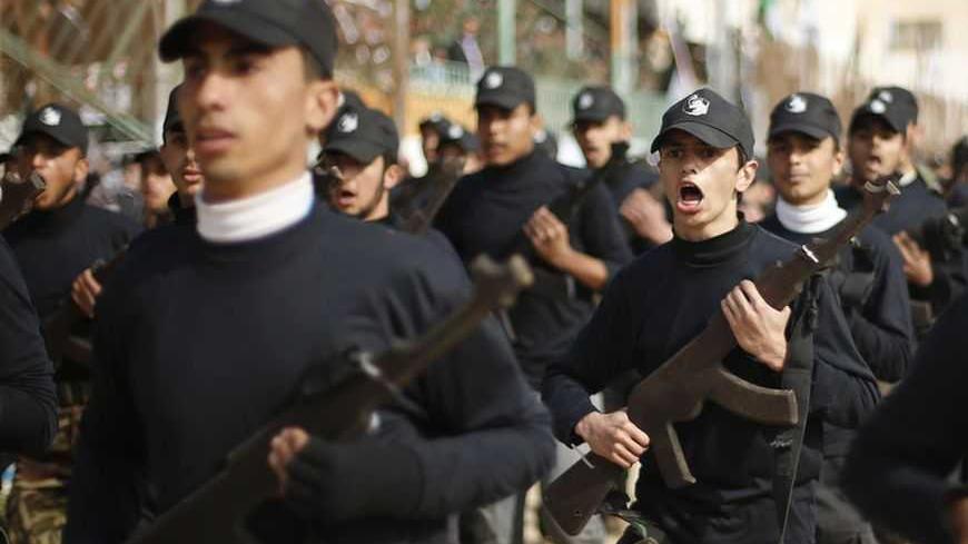 Palestinian students demonstrate their skills during a graduation ceremony for martial arts course organized by Hamas ministry of education in Gaza City January 24, 2013.  REUTERS/Mohammed Salem   (GAZA - Tags: POLITICS CIVIL UNREST)