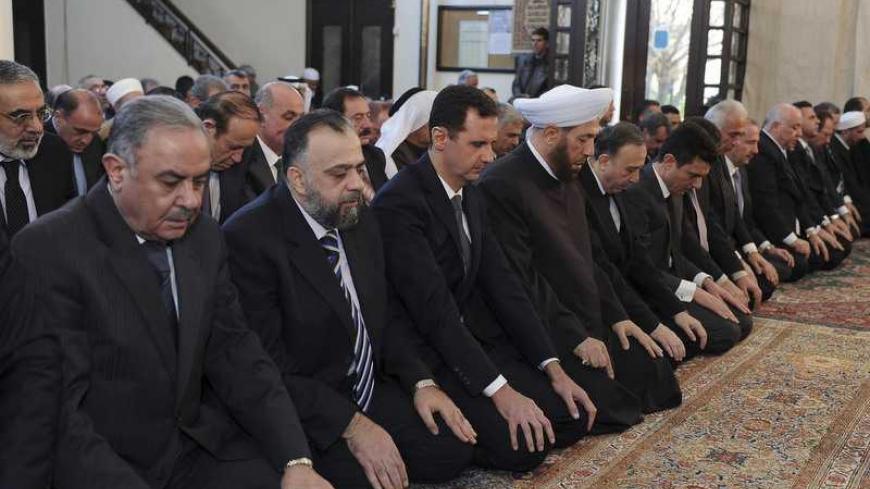 Syria's President Bashar al-Assad (3rd L) prays during celebrations of Prophet Mohammed's birthday, at the al-Afram mosque in Damascus January 24, 2013, in this handout picture provided by Syria's national news agency SANA. REUTERS/SANA/Handout (SYRIA - Tags: POLITICS RELIGION ANNIVERSARY) ATTENTION EDITORS - THIS PICTURE WAS PROVIDED BY A THIRD PARTY. REUTERS IS UNABLE TO INDEPENDENTLY VERIFY THE AUTHENTICITY, CONTENT, LOCATION OR DATE OF THIS IMAGE. FOR  EDITORIAL USE ONLY. NOT FOR SALE FOR MARKETING OR A