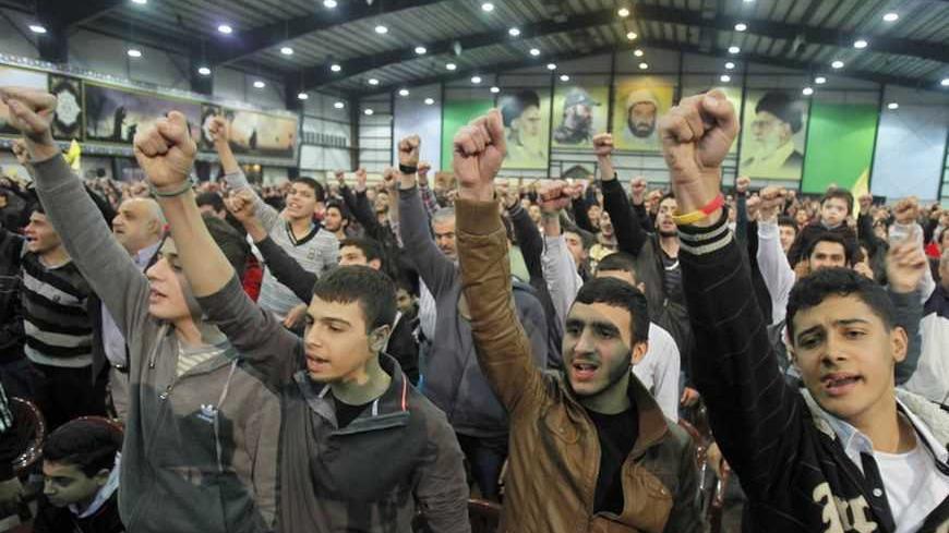 Supporters of Lebanon's Hezbollah leader Sayyed Hassan Nasrallah shout slogans during a rally to commemorate the birth of Prophet Mohammad in Beirut's suburbs, January 25, 2013. REUTERS/Sharif Karim (LEBANON - Tags: POLITICS)