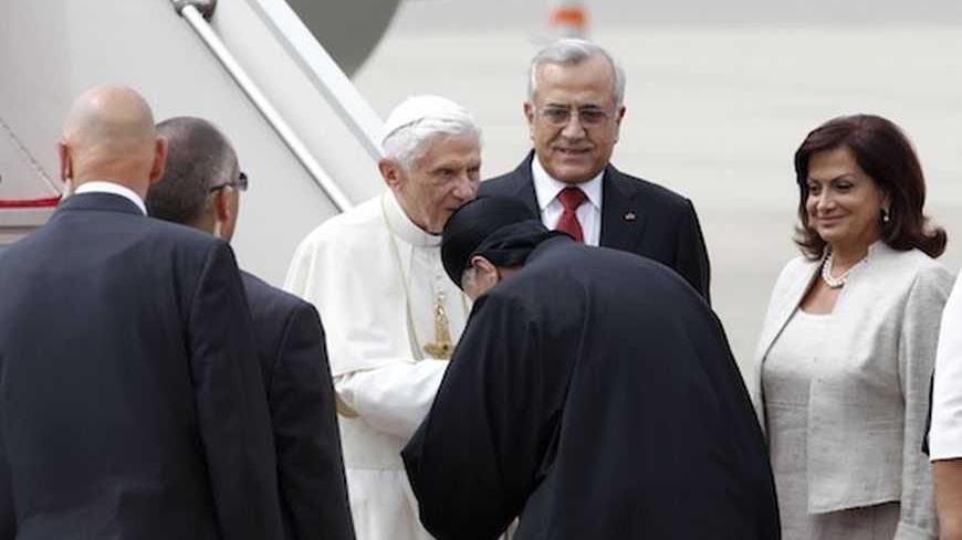 Pope Benedict XVI is greeted by the patriarch of Lebanese Christian Maronites, Bishara Boutros al-Rai, as Lebanon's President looks on upon  his arrival at Beirut's airport September, 14, 2012. REUTERS/ Jamal Saidi          (LEBANON - Tags: RELIGION POLITICS) - RTR37YUG