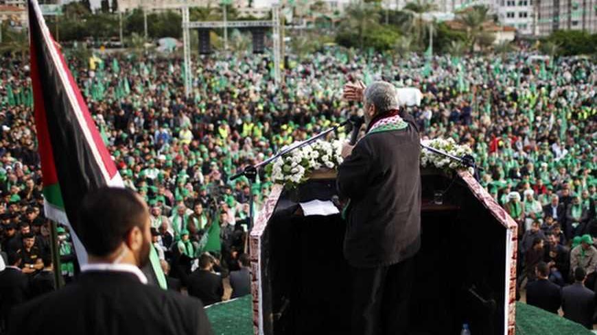 Hamas chief Khaled Meshaal gives a speech during a rally marking the 25th anniversary of the founding of Hamas, in Gaza City December 8, 2012. Meshaal, in an uncompromising speech during his first ever visit to Gaza after decades of exile, told a mass rally on Saturday he would never recognise Israel and pledged to "free the land of Palestine inch by inch". REUTERS/Ahmed Jadallah (GAZA - Tags: POLITICS ANNIVERSARY CIVIL UNREST)