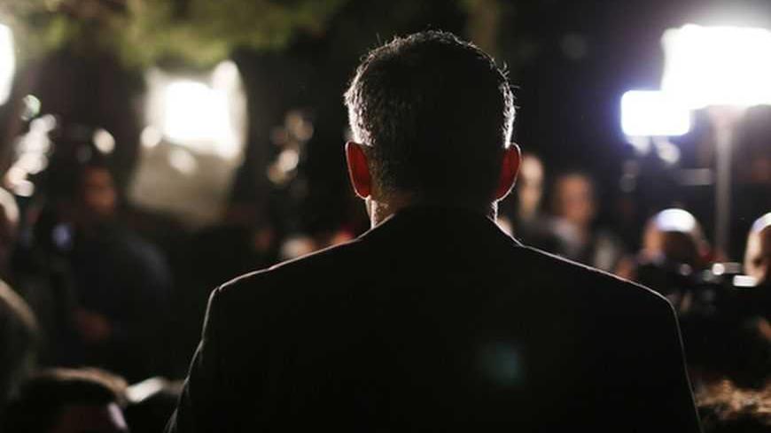 Yair Lapid, leader of the Yesh Atid (There's a Future) party, speaks to members of the media outside his home in Tel Aviv January 23, 2013. Lapid, a former television news anchor whose new centrist party stormed to second place in Israel's election, may well be the kingmaker holding the keys to the next coalition government. REUTERS/Amir Cohen (ISRAEL - Tags: POLITICS ELECTIONS)