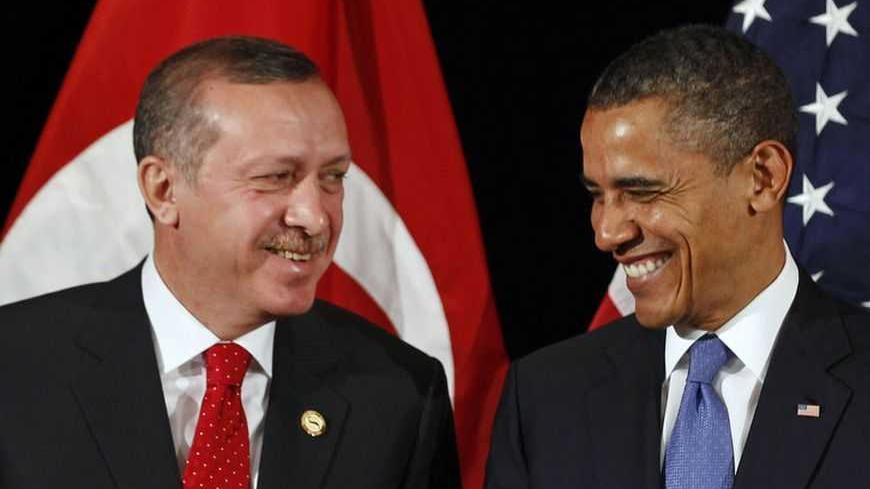 U.S. President Barack Obama (R) and Turkey's Prime Minister Recep Tayyip Erdogan talk to members of the press after a bilateral meeting ahead of the Nuclear Security Summit in Seoul March 25, 2012.     REUTERS/Larry Downing        (SOUTH KOREA - Tags: POLITICS MILITARY) - RTR2ZUEN