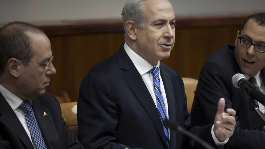 Israel's Prime Minister Benjamin Netanyahu (C) attends the weekly cabinet meeting in Jerusalem February 10, 2013. Iran's nuclear ambitions, the civil war in Syria and stalled Israeli-Palestinian peace efforts will top the agenda of U.S. President Barack Obama's visit to Israel, Netanyahu said on Sunday. REUTERS/Uriel Sinai/Pool (JERUSALEM - Tags: POLITICS) - RTR3DKNE