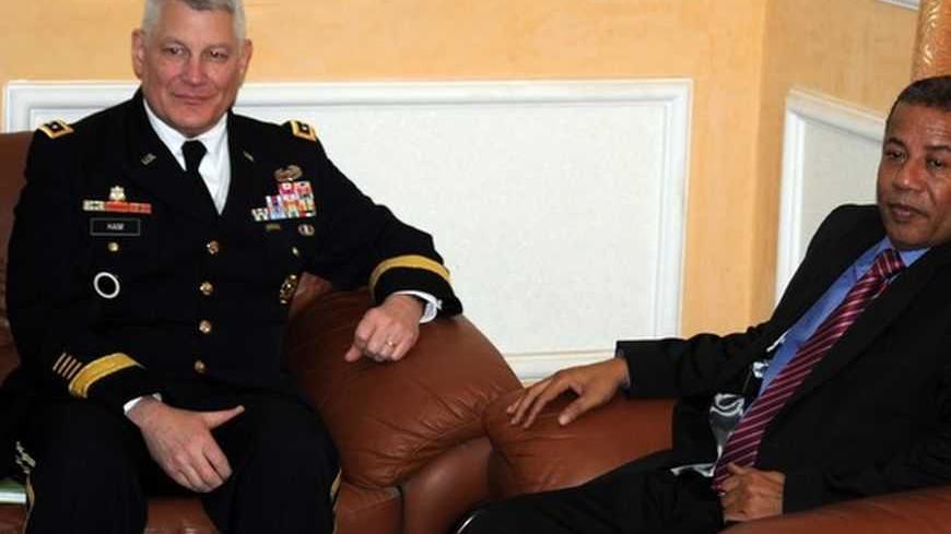 US AFRICOM General Carter Ham (L) meets with Mauritania's Defence Minister Ahmedou Ould Ideye (R) on Febuary 26, 2013 in Nouakchott. AFP PHOTO / STR        (Photo credit should read -/AFP/Getty Images)